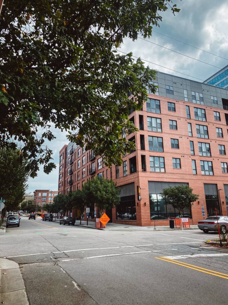 a red brick building with a tree