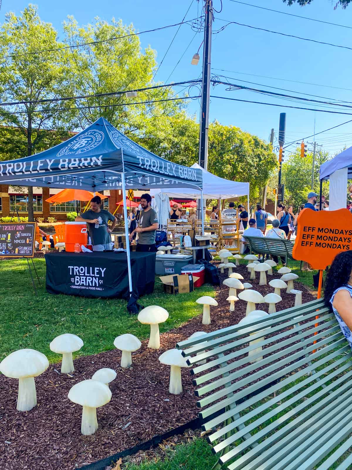 an outside bar covered by a tent at a farmers market in Charlotte, North Carolina
