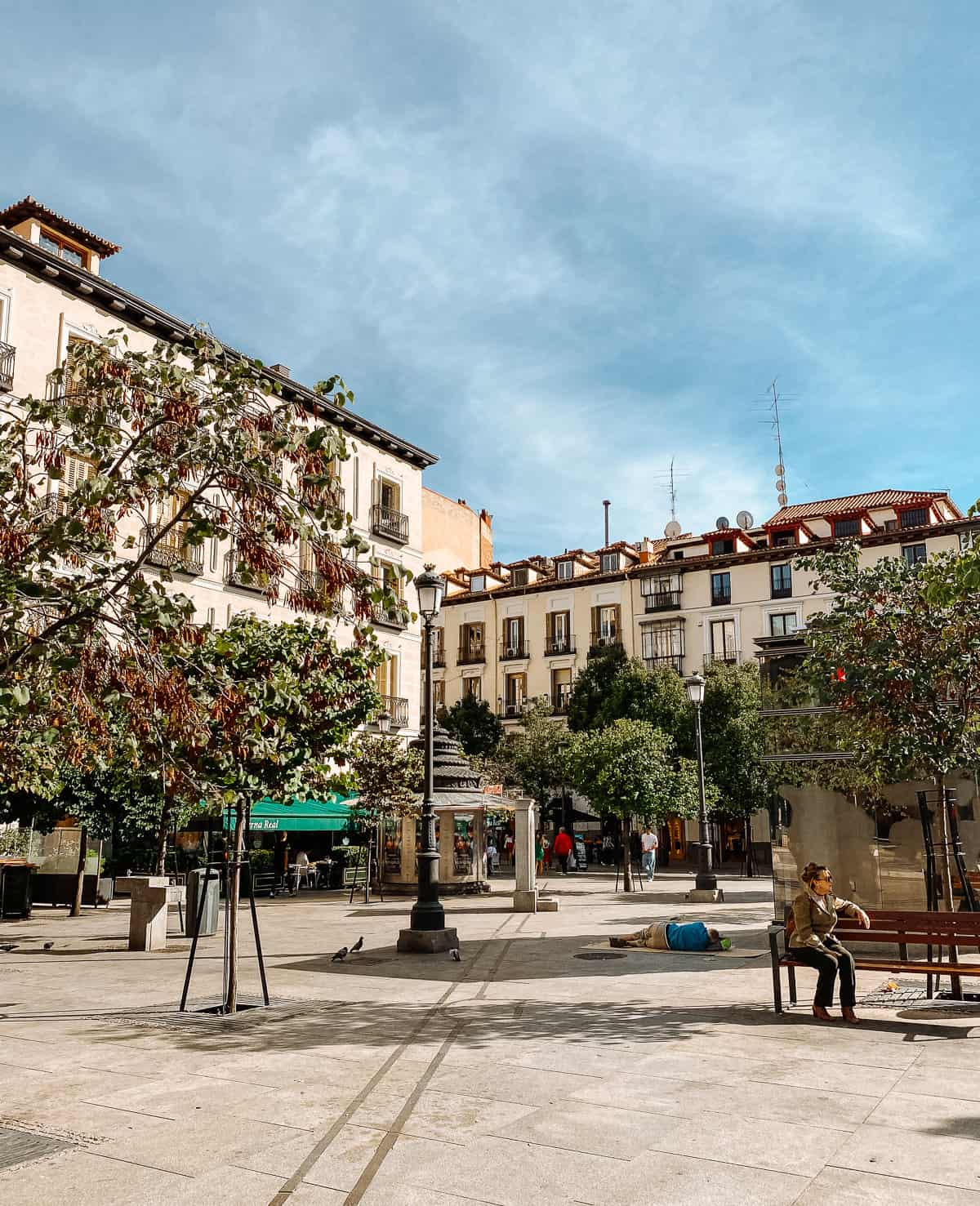 A town square with old peach colored buildings