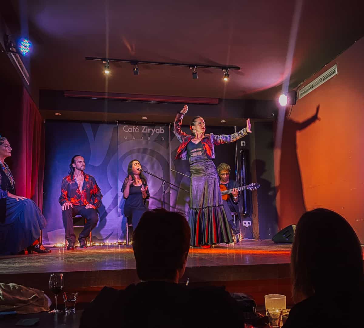 A woman dancing flamenco on a stage