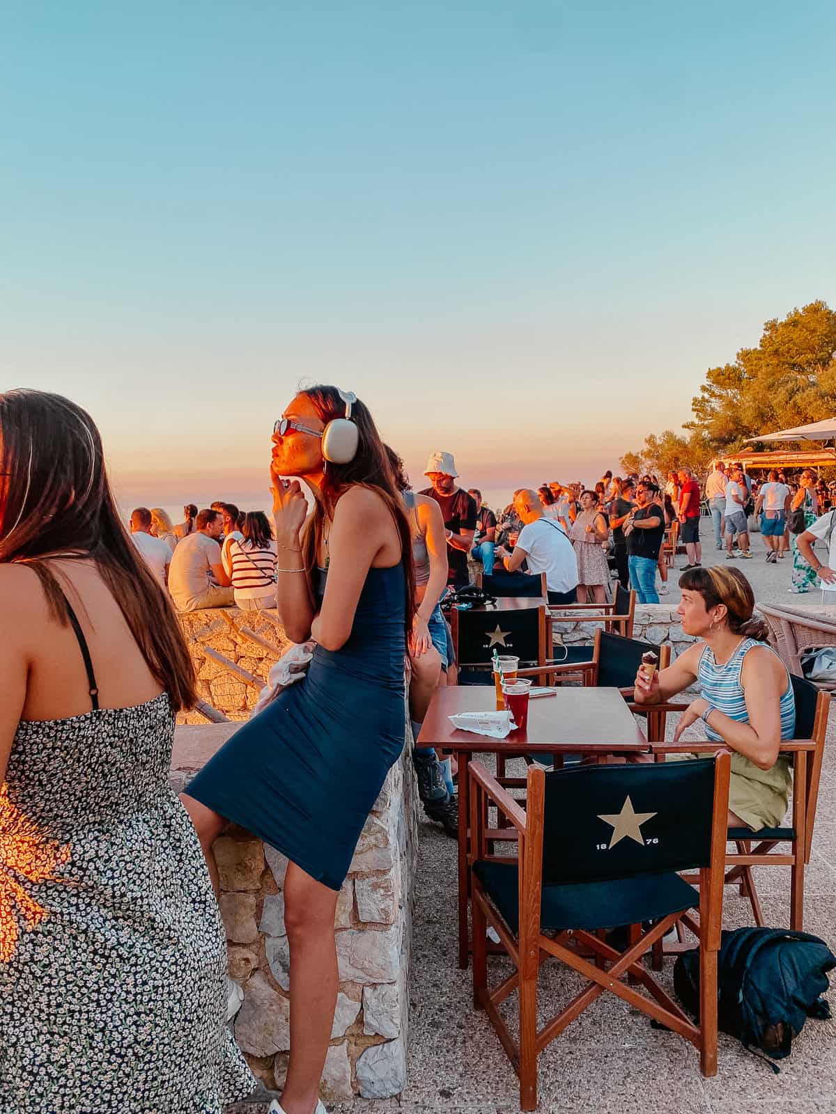 A large number of tourists watching the sunset