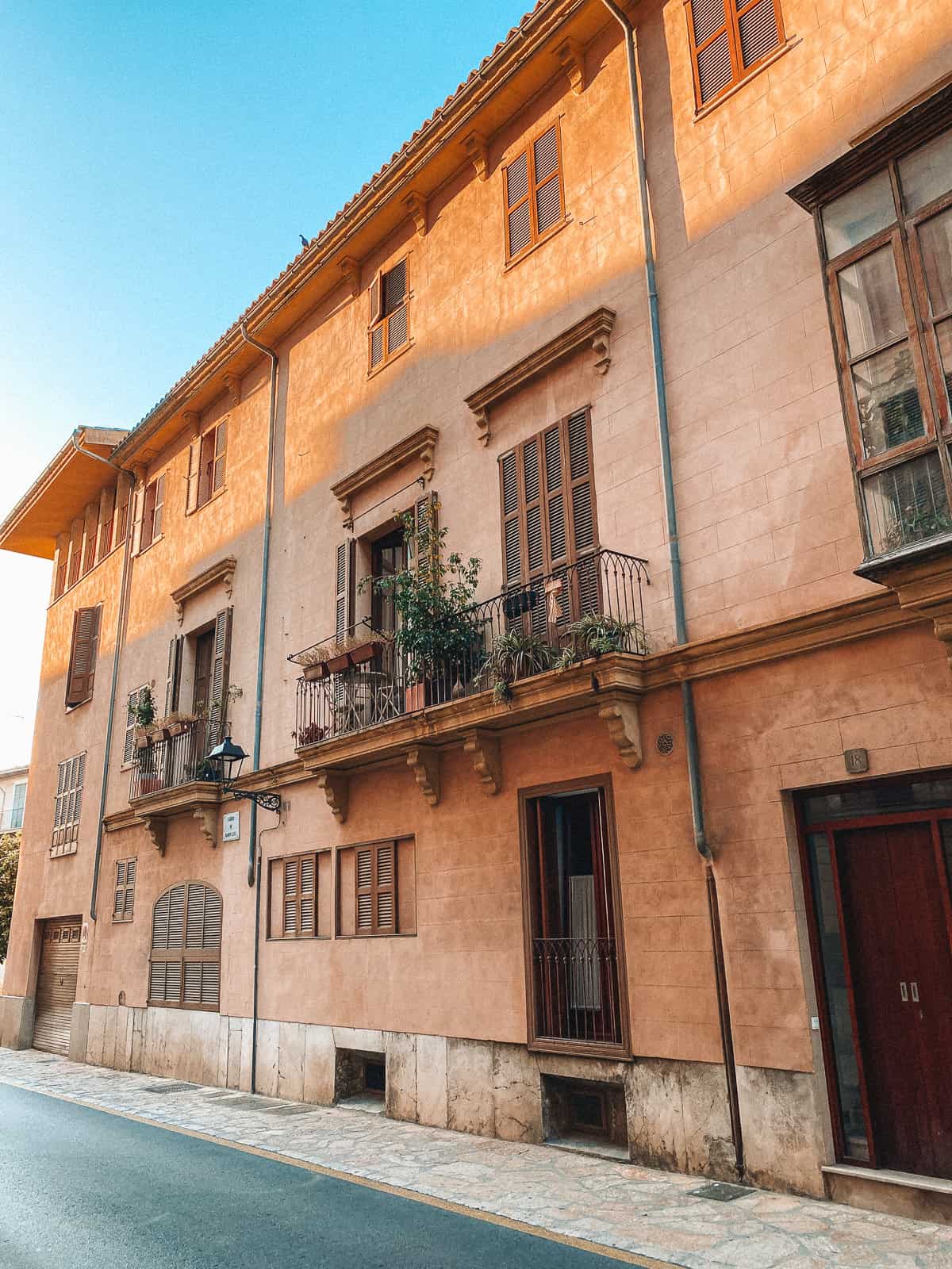 beautiful brownstone buildings on a cobblestone street