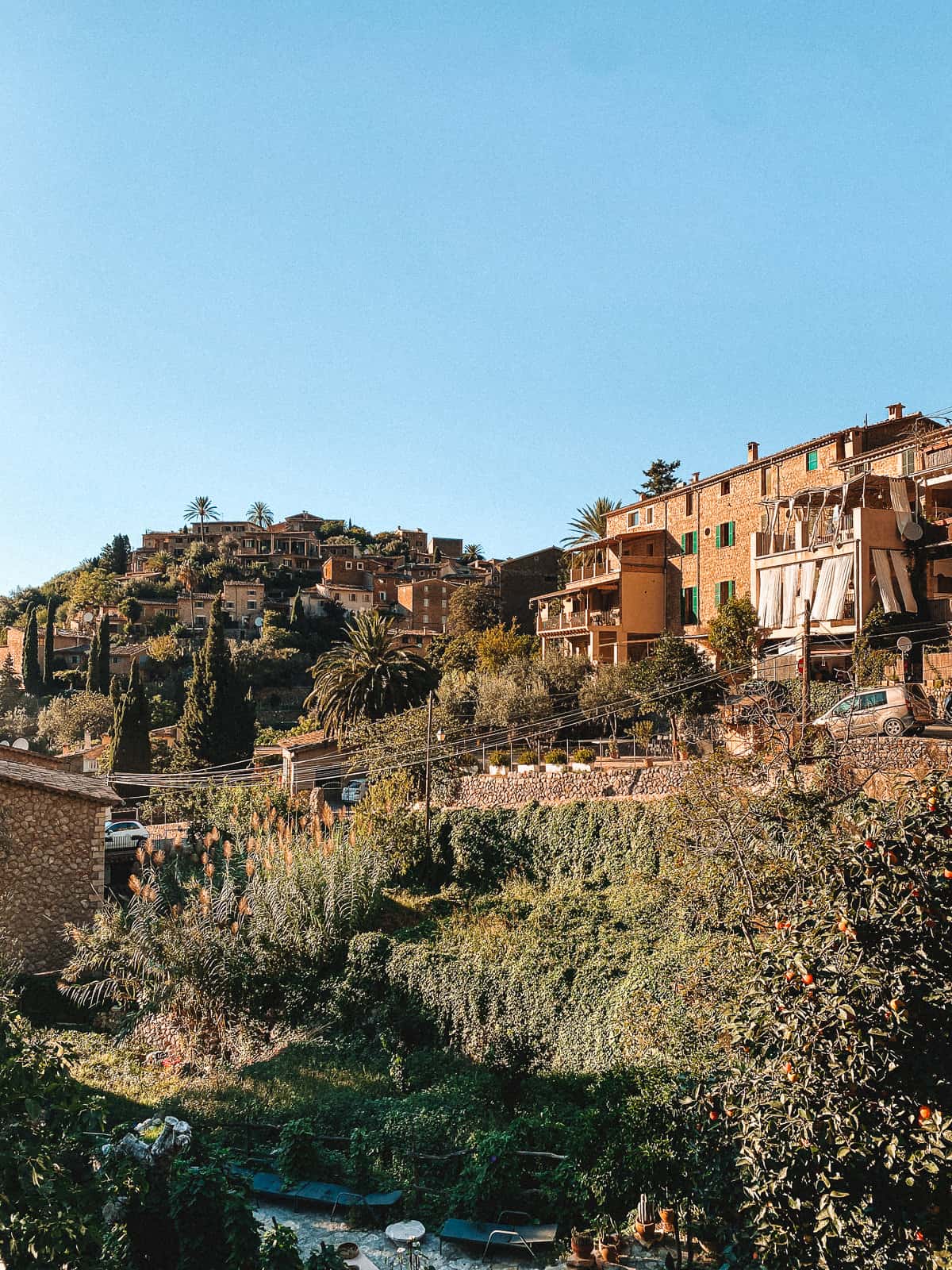 a beautiful stone village on a hill in the mountains