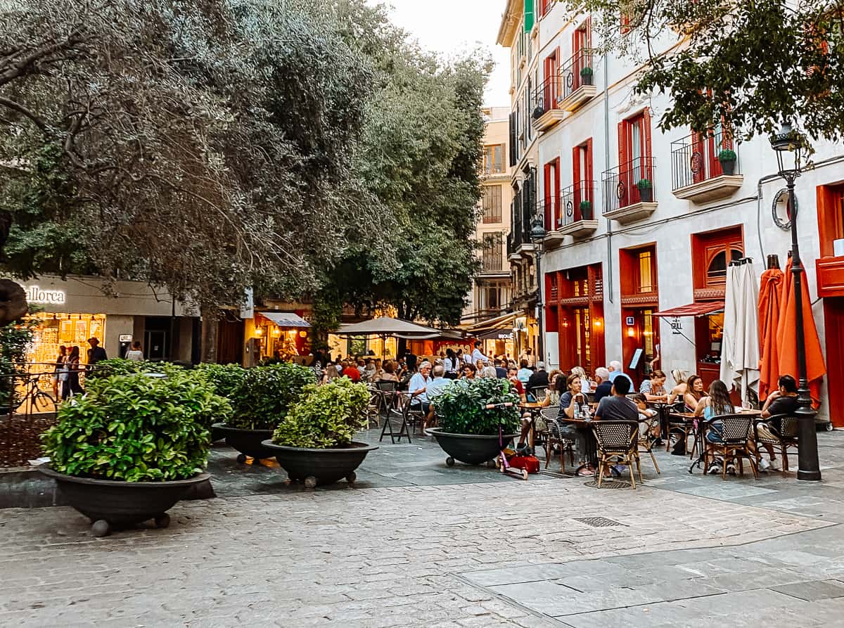 People sitting at a cafe in Europe eating lunch
