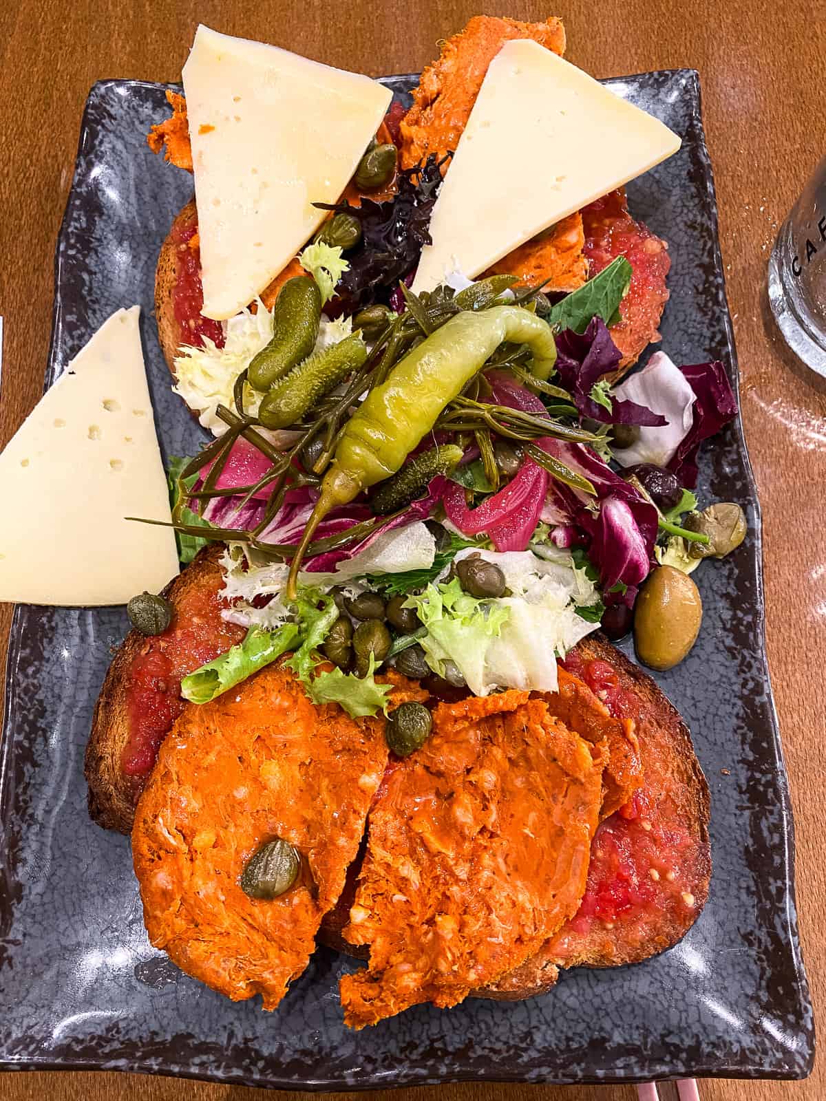 Toast with spreadable sausage and cheese on top