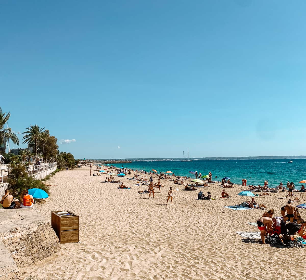a white sandy beach on the Mediterranean with bright blue sky