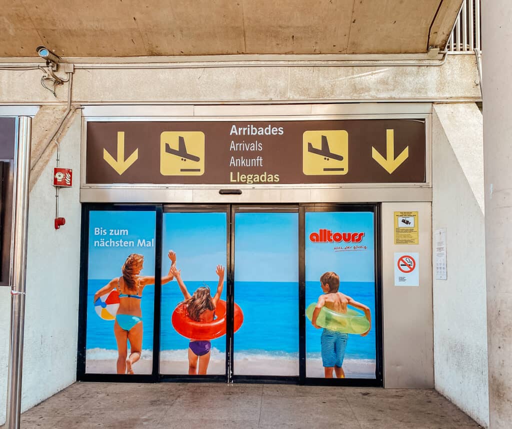 The arrival hall sign at an airport
