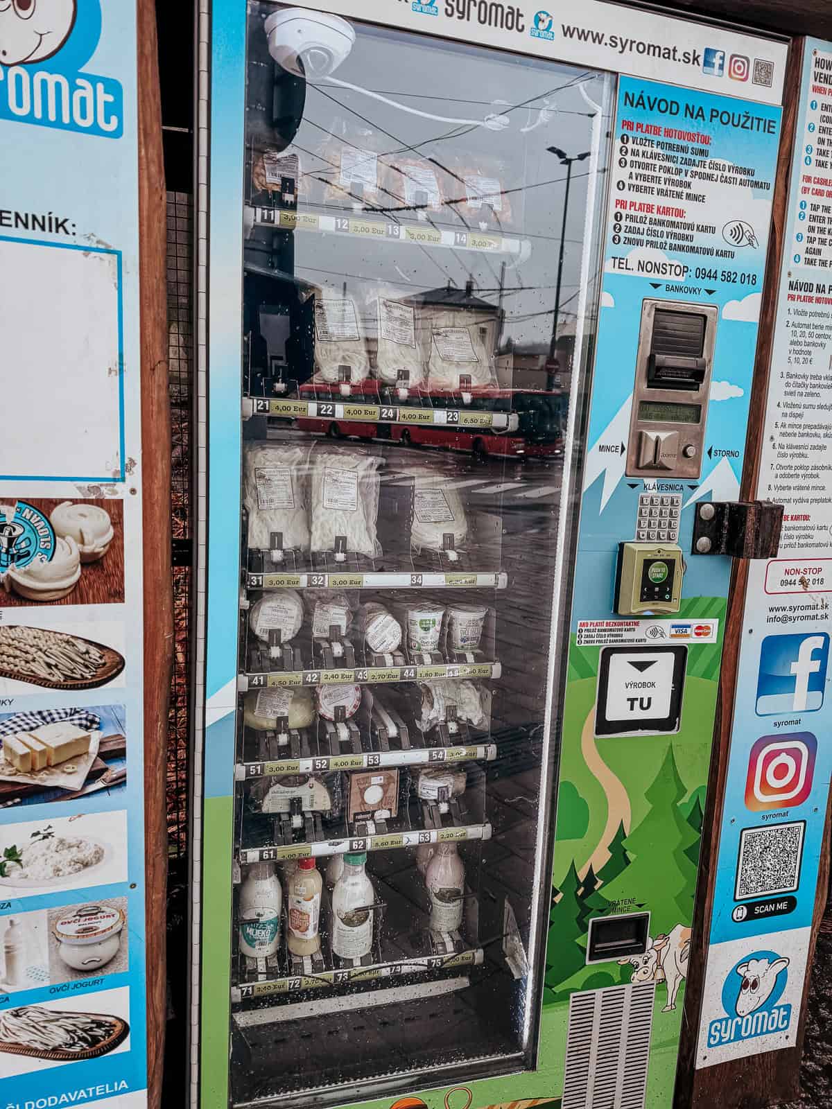 A unique vending machine ("Syromat") that dispenses various dairy products and cheeses, featured in an urban setting with informative posters and social media QR codes.