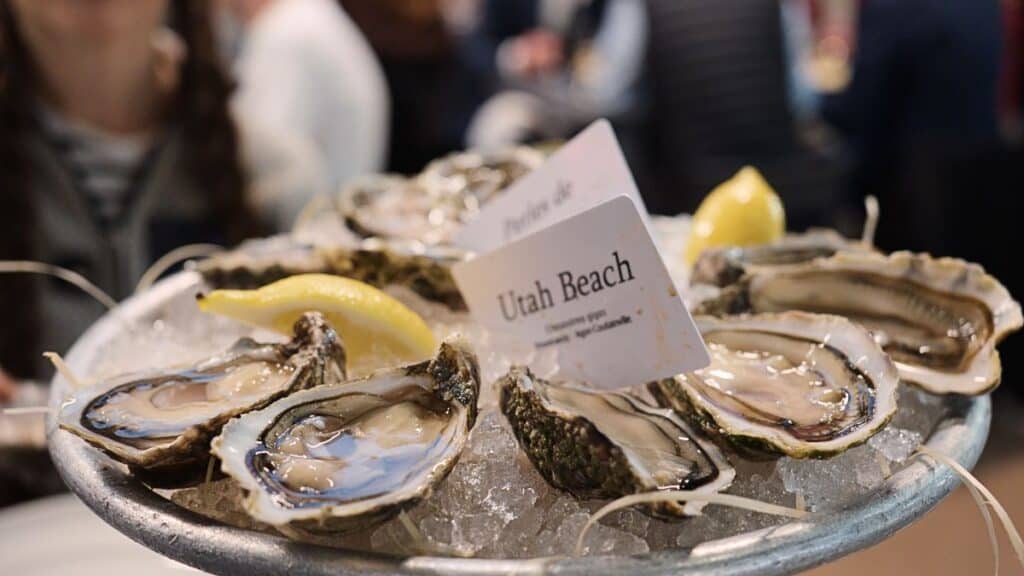 oysters on a plate with a sign that says Utah Beach