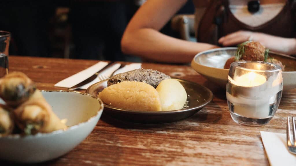 Traditional haggis, neeps, and tatties served at a modern Scottish restaurant in Glasgow